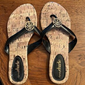 Black and Tan flip flops. Good condition